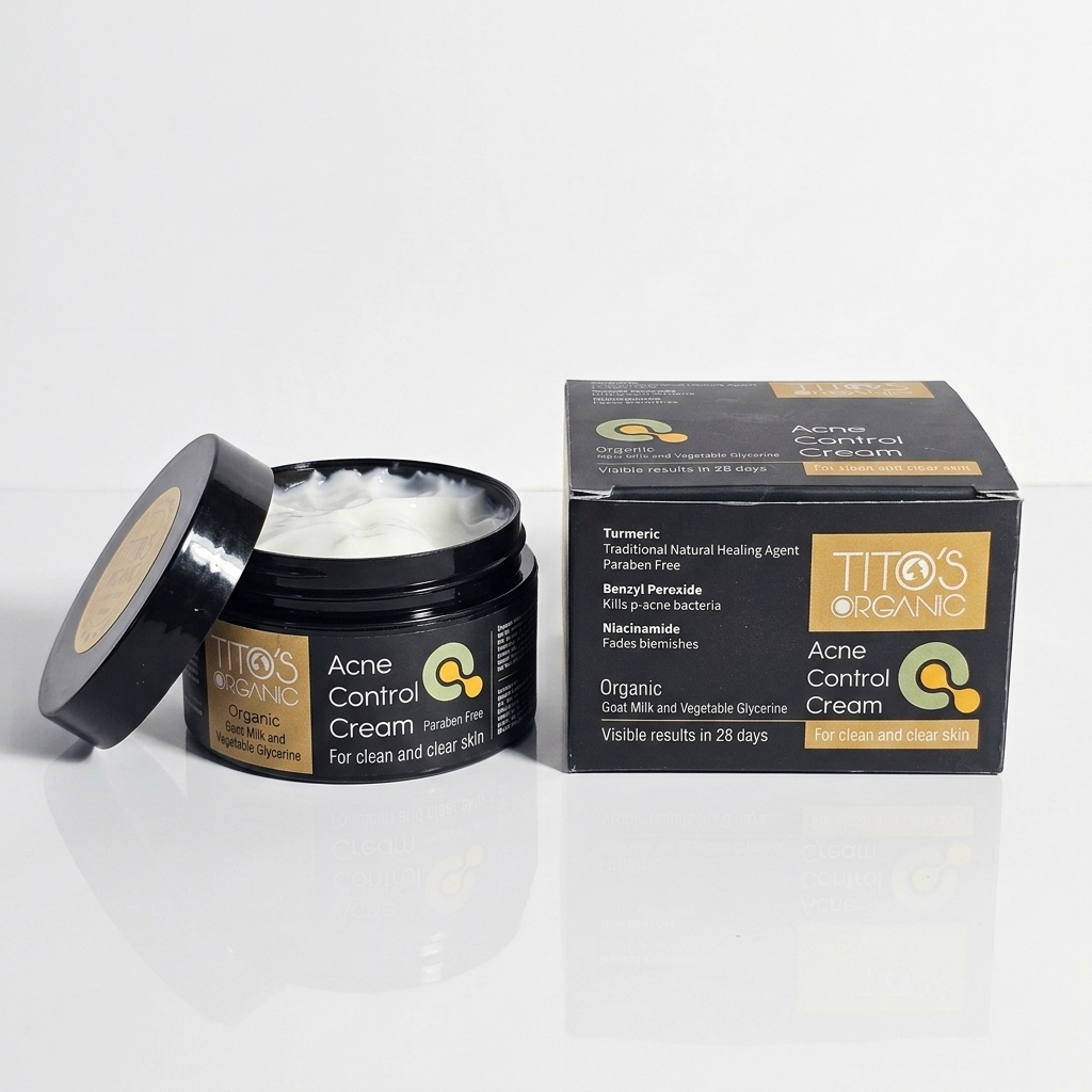 Open jar of Tito’s Organic Acne Control Cream showing cream texture with packaging box