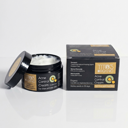 Open jar of Tito’s Organic Acne Control Cream showing cream texture with packaging box